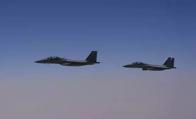 Saudi Air Force F-15 warplanes escort Air Force One carrying President Donald Trump as it arrives in Saudi Arabia, Tuesday, May 13, 2025. (AP Photo/Alex Brandon)