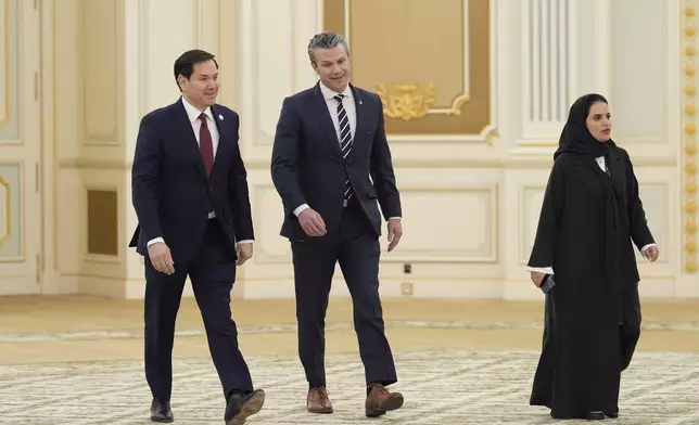 Secretary of Defense Pete Hegseth, right, and Secretary of State Marco Rubio arrive for a signing ceremony at the Royal Palace in Riyadh, Saudi Arabia, Tuesday, May 13, 2025. (AP Photo/Alex Brandon)