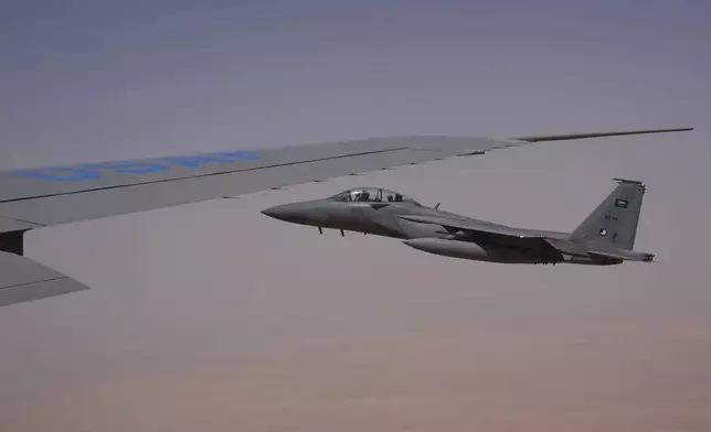 Saudi Air Force F-15 warplanes escort Air Force One carrying President Donald Trump as it arrives in Saudi Arabia, Tuesday, May 13, 2025. (AP Photo/Alex Brandon)