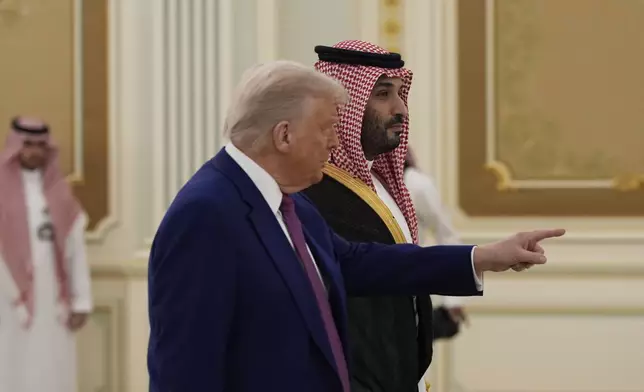President Donald Trump and Saudi Crown Prince Mohammed bin Salman arrive for a signing ceremony at the Royal Palace in Riyadh, Saudi Arabia, Tuesday, May 13, 2025. (AP Photo/Alex Brandon)