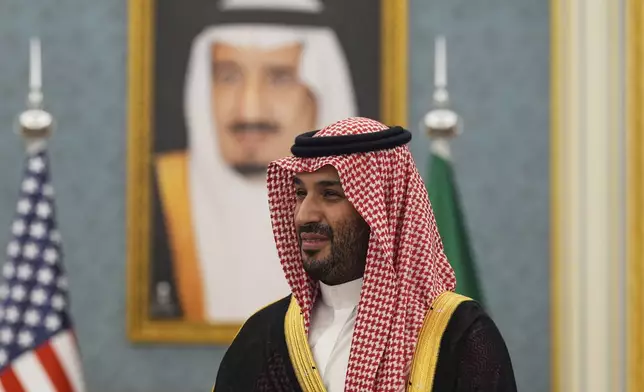 Saudi Crown Prince Mohammed bin Salman joins President Donald Trump to greet delegations at the Royal Palace in Riyadh, Saudi Arabia, Tuesday, May 13, 2025. (AP Photo/Alex Brandon)