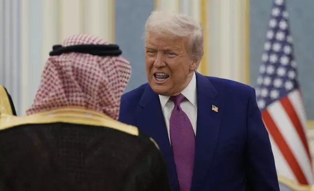 President Donald Trump greets delegations during an arrival ceremony at the Royal Palace in Riyadh, Saudi Arabia, Tuesday, May 13, 2025. (AP Photo/Alex Brandon)