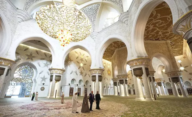 President Donald Trump and Sheikh Khaled Mohammed bin Zayed Al Nahyan, Crown Prince of Abu Dhabi, right, tour the Sheikh Zayed Grand Mosque, Thursday, May 15, 2025, in Abu Dhabi, United Arab Emirates. (AP Photo/Alex Brandon)