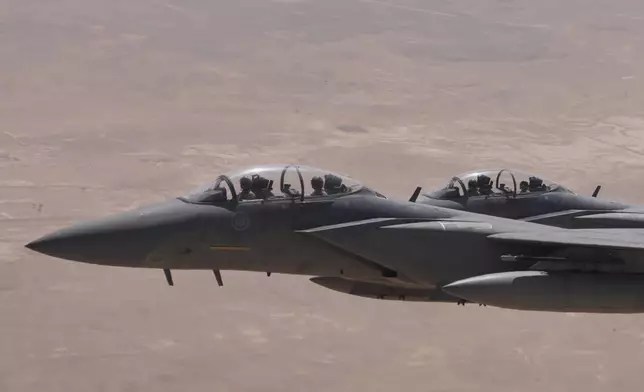 Saudi Air Force F-15 warplanes escort Air Force One carrying President Donald Trump as it arrives in Saudi Arabia, Tuesday, May 13, 2025. (AP Photo/Alex Brandon)