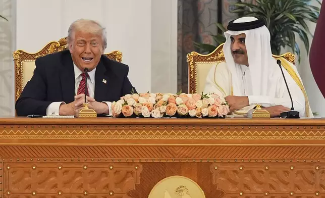 President Donald Trump speaks a signing ceremony with Qatar's Emir Sheikh Tamim bin Hamad Al Thani at the Amiri Diwan in Doha, Qatar, Wednesday, May 14, 2025. (AP Photo/Alex Brandon)