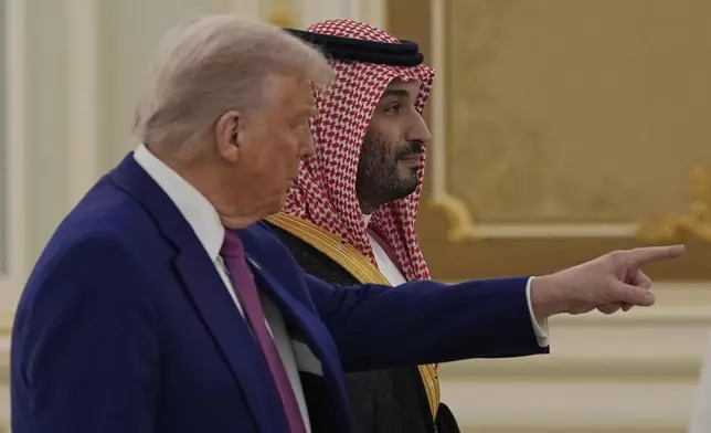 President Donald Trump and Saudi Crown Prince Mohammed bin Salman arrive for a signing ceremony at the Royal Palace in Riyadh, Saudi Arabia, Tuesday, May 13, 2025. (AP Photo/Alex Brandon)