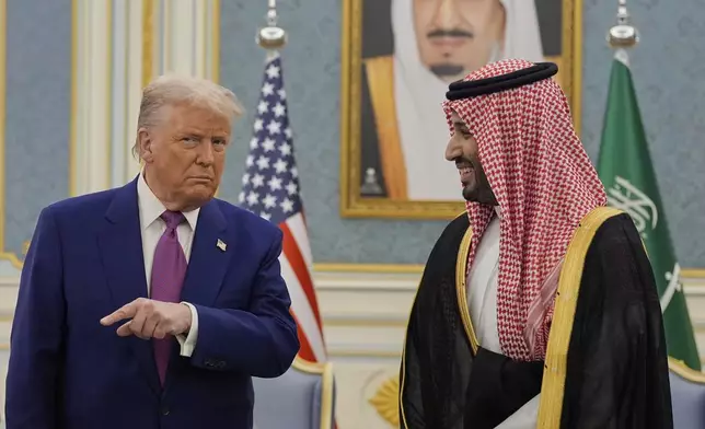 President Donald Trump and Saudi Crown Prince Mohammed bin Salman speaks as they meet delegations during an arrival ceremony at the Royal Palace in Riyadh, Saudi Arabia, Tuesday, May 13, 2025. (AP Photo/Alex Brandon)