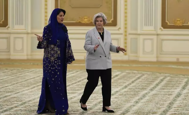 Reema bint Bandar Al Saud, Saudi ambassador to the United States, speaks with White House Chief of Staff Susie Wiles at the Royal Palace ahead of a signing ceremony in Riyadh, Saudi Arabia, Tuesday, May 13, 2025. (AP Photo/Alex Brandon)