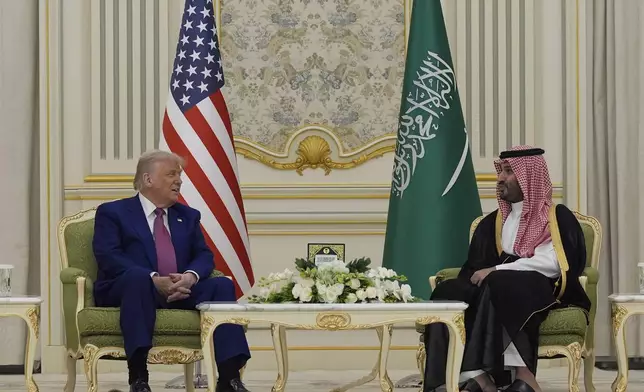 President Donald Trump and Saudi Crown Prince Mohammed bin Salman speak as they attend a signing ceremony at the Royal Palace in Riyadh, Saudi Arabia, Tuesday, May 13, 2025. (AP Photo/Alex Brandon)
