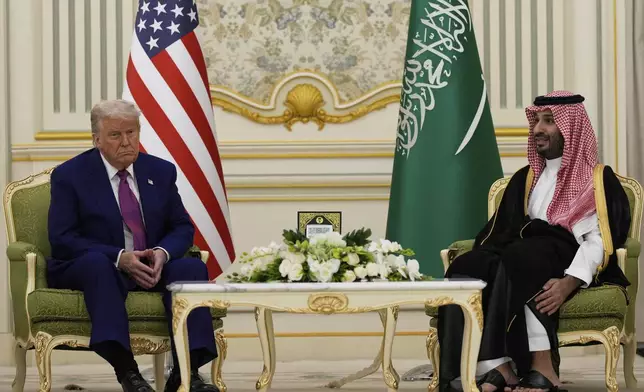 President Donald Trump and Saudi Crown Prince Mohammed bin Salman speak during a meeting at the Royal Palace in Riyadh, Saudi Arabia, Tuesday, May 13, 2025. (AP Photo/Alex Brandon)