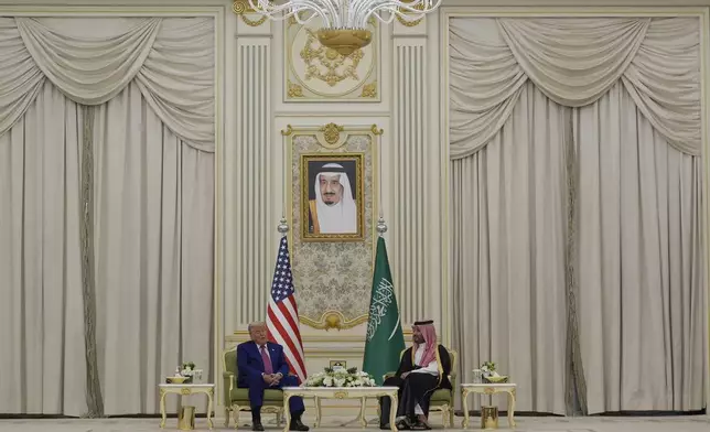 President Donald Trump and Saudi Crown Prince Mohammed bin Salman speak as they attend a signing ceremony at the Royal Palace in Riyadh, Saudi Arabia, Tuesday, May 13, 2025. (AP Photo/Alex Brandon)