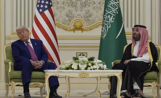 President Donald Trump and Saudi Crown Prince Mohammed bin Salman speak as they attend a signing ceremony at the Royal Palace in Riyadh, Saudi Arabia, Tuesday, May 13, 2025. (AP Photo/Alex Brandon)