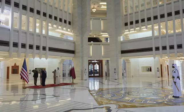 President Donald Trump and Qatar's Emir Sheikh Tamim bin Hamad Al Thani take part in an official welcoming ceremony at the Amiri Diwan in Doha, Qatar, Wednesday, May 14, 2025. (AP Photo/Alex Brandon)