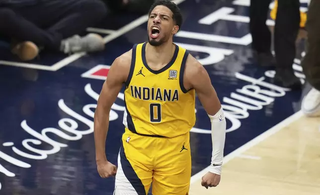 Indiana Pacers guard Tyrese Haliburton celebrates during the first half of Game 3 of the Eastern Conference finals of the NBA basketball playoffs against the New York Knicks Sunday, May 25, 2025, in Indianapolis. (AP Photo/Jeff Roberson)
