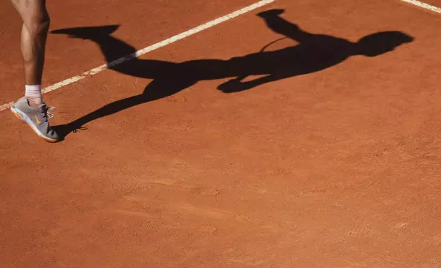 Spain's Carlos Alcaraz returns the ball to Italy's Lorenzo Musetti during their semifinal tennis match at the Italian Open, in Rome, Friday, May 16, 2025. (AP Photo/Andrew Medichini)