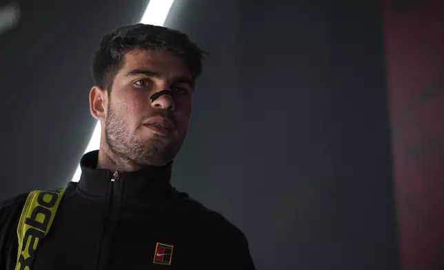 Spain's Carlos Alcaraz prepares to enter the central court to start his semifinal tennis match against Italy's Lorenzo Musetti at the Italian Open, at the Foro Italico, in Rome, Friday, May 16, 2025. (AP Photo/Andrew Medichini)