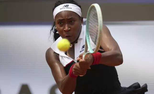 United States' Coco Gauff returns the ball to Russia's Mirra Andreeva during their tennis match at the Italian Open at the Foro Italico, in Rome, Wednesday, May 14, 2025.(AP Photo/Alessandra Tarantino)