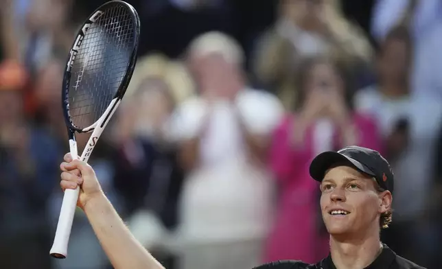 Italy's Jannik Sinner waves after beating Norway's Casper Ruud, at the end of their quarterfinal tennis match at the Italian Open, at the Foro Italico, in Rome, Thursday, May 15, 2025. (AP Photo/Alessandra Tarantino)