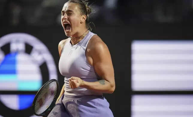 Aryna Sabalenka of Belarus reacts during a quarter-final tennis match against China's Qinwen Zheng at the Italian Open in Rome, Italy, Wednesday, May 14, 2025. (AP Photo/Alessandra Tarantino)