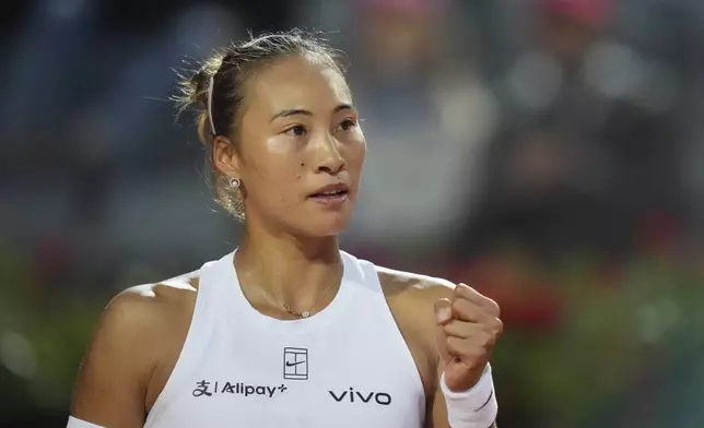 China's Qinwen Zheng reacts during a quarter-final tennis match against Aryna Sabalenka of Belarus at the Italian Open in Rome, Italy, Wednesday, May 14, 2025. (AP Photo/Alessandra Tarantino)