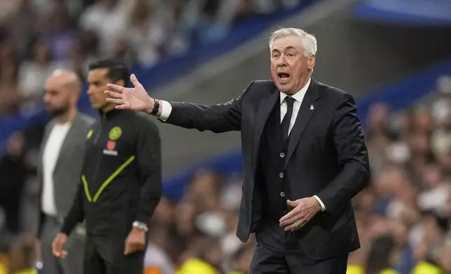 Real Madrid's head coach Carlo Ancelotti reacts during the Spanish La Liga soccer match between Real Madrid and Celta Vigo at the Santiago Bernabeu stadium in Madrid, Spain, Sunday, May 4, 2025. (AP Photo/Jose Breton)