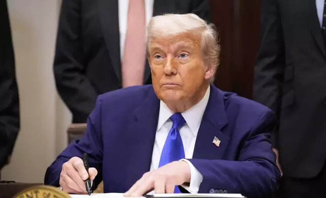 President Donald Trump signs an executive order related to drug prices, in the Roosevelt Room of the White House in Washington, Monday, May 12, 2025, in Washington. (AP Photo/Mark Schiefelbein)