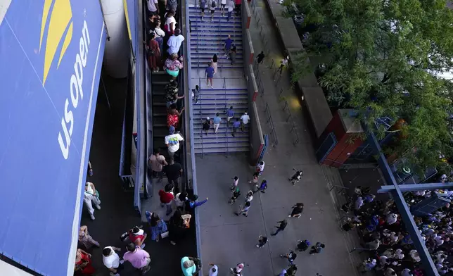 FILE- Fans enter Arthur Ashe Stadium during the second round of the U.S. Open tennis championships, Wednesday, Aug. 31, 2022, in New York. (AP Photo/Frank Franklin II, file)