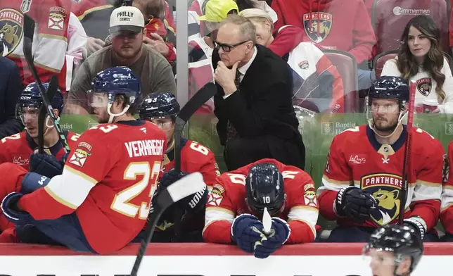 Florida Panthers head coach Paul Maurice, center, rear, talks with players during the third period in Game 6 of a second-round NHL hockey playoff series against the Toronto Maple Leafs, Friday, May 16, 2025, in Sunrise, Fla. (AP Photo/Lynne Sladky)
