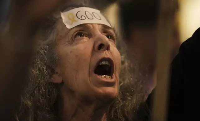 A woman shouts in a rally marking 600 days since Israelis were taken hostage by Hamas in Gaza, demanding their release and an end to the war, in Tel Aviv, Israel, on Wednesday, May 28, 2025. (AP Photo/Leo Correa)