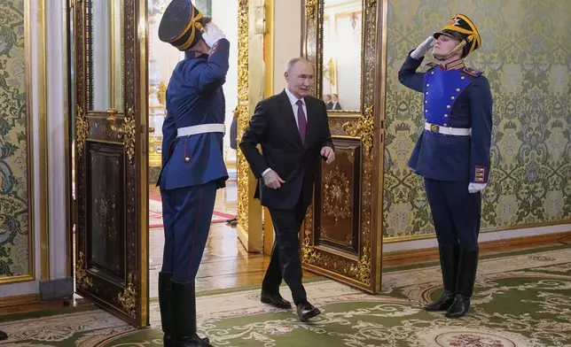 Russian President Vladimir Putin arrives for a meeting with Chairman of Yemeni presidential leadership council Rashad al-Alimi in the Grand Palace at the Kremlin in Moscow, Russia, Wednesday, May 28, 2025. (AP Photo/Pavel Bednyakov, Pool)