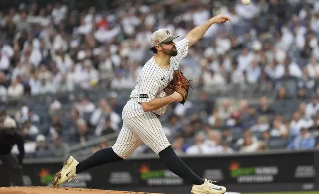 New York Yankees pitcher Carlos Rodón throws during the first inning of a baseball game against the New York Mets Friday, May 16, 2025, in New York. (AP Photo/Seth Wenig)