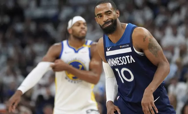 Minnesota Timberwolves guard Mike Conley reacts after Golden State Warriors guard Buddy Hield scores during the first half of Game 5 of an NBA basketball second-round playoff series, Wednesday, May 14, 2025, in Minneapolis. (AP Photo/Abbie Parr)