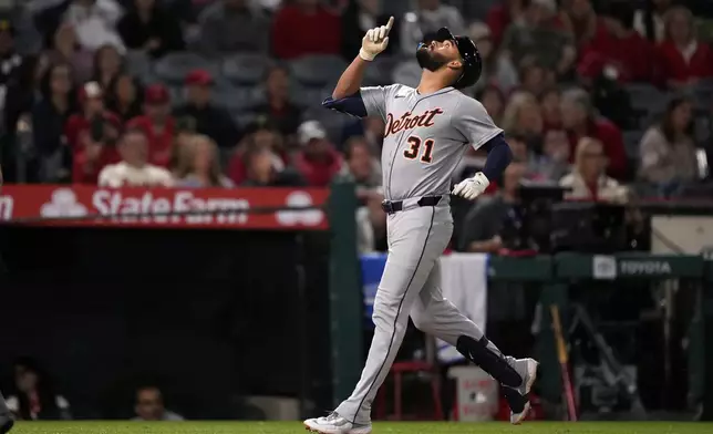 Detroit Tigers' Riley Greene gestures as he scores after hitting a solo home run during the ninth inning of a baseball game against the Los Angeles Angels, Friday, May 2, 2025, in Anaheim, Calif. (AP Photo/Mark J. Terrill)