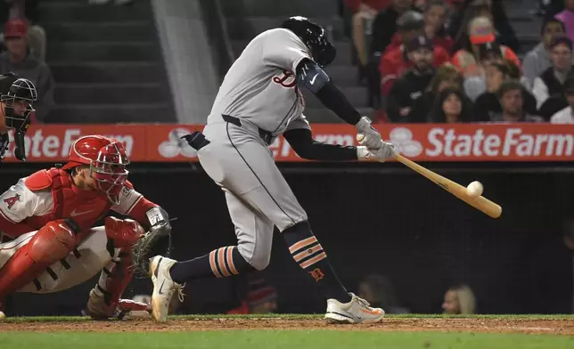 Detroit Tigers' Trey Sweeney hits a solo home run as Los Angeles Angels catcher Logan O'Hoppe watches during the seventh inning of a baseball game Friday, May 2, 2025, in Anaheim, Calif. (AP Photo/Mark J. Terrill)