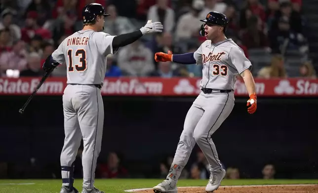 Detroit Tigers' Colt Keith, right, celebrates with Dillon Dingler after hitting a solo home run during the ninth inning of a baseball game against the Los Angeles Angels, Friday, May 2, 2025, in Anaheim, Calif. (AP Photo/Mark J. Terrill)