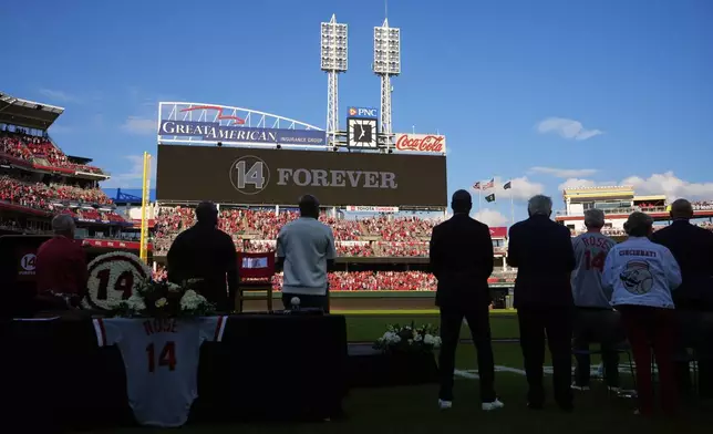 Cincinnatio Reds fame stand during a Pete Rose Night event before a baseball game between the Cincinnati Reds and the Chicago White Sox, Wednesday, May 14, 2025, in Cincinnati. (AP Photo/Carolyn Kaster)