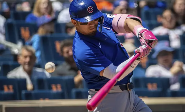 Chicago Cubs outfielder Seiya Suzuki (27) strikes out swinging during the first inning of the baseball game against the New York Mets, Sunday, May 11, 2025, in New York. (AP Photo/Angelina Katsanis)