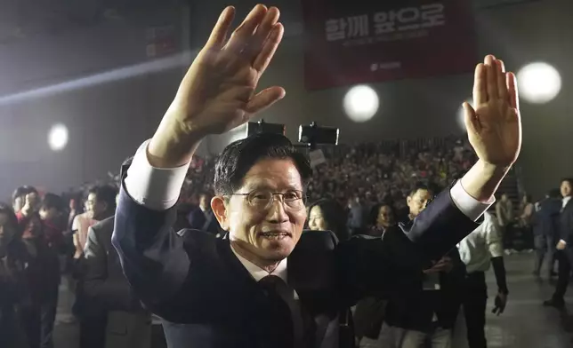 South Korea's former Labor Minister Kim Moon Soo waves as he arrives to attend the People Power Party's convention in Goyang, South Korea, Saturday, May 3, 2025. (AP Photo/Ahn Young-joon)