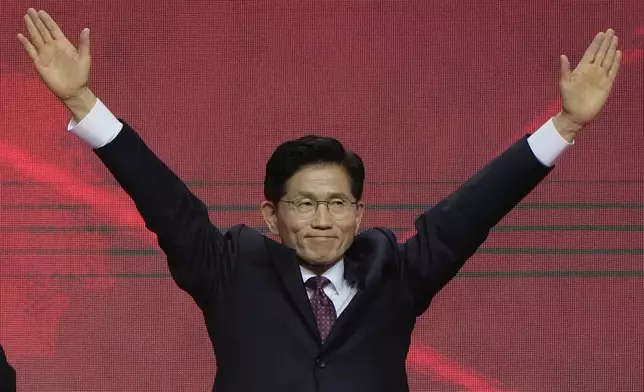 South Korea's former Labor Minister Kim Moon Soo celebrates after winning the nomination as the presidential election candidate during the People Power Party's convention in Goyang, South Korea, Saturday, May 3, 2025. (AP Photo/Ahn Young-joon)