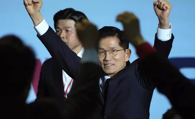 South Korea's former Labor Minister Kim Moon Soo is greeted by supporters as he arrives to attend the People Power Party's convention in Goyang, South Korea, Saturday, May 3, 2025. (AP Photo/Ahn Young-joon)