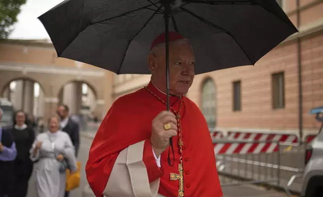 German cardinal Gerhard Ludwig Müller walks in St. Peter's Square, at the Vatican, Wednesday, May 7, 2025. (AP Photo/Francisco Seco)