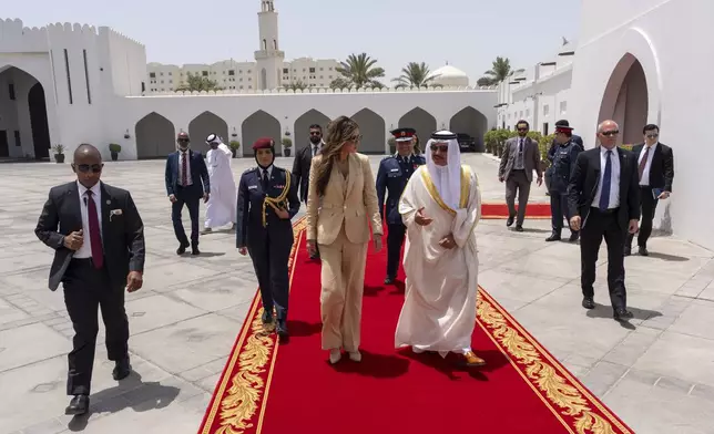 Homeland Security Secretary Kristi Noem walks with Bahrain's Interior Minister Gen. Shaikh Rashid bin Abdulla Al Khalifa, Sunday, May 25, 2025, in Manama, Bahrain. (AP Photo/Alex Brandon, Pool)