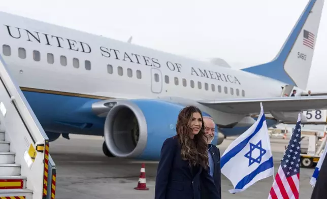 Homeland Security Secretary Kristi Noem walks with Ambassador Mike Huckabee arrives at Ben Gurion Airport, Sunday, May 25, 2025, Tel Aviv, Israel. (AP Photo/Alex Brandon, Pool)