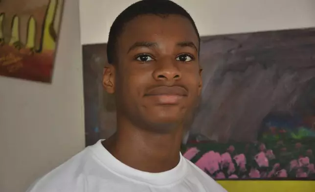 Kanyeyachukwu Tagbo Okeke, a 15 year-old autistic Nigerian, who set a Guinness World Record for the world's largest art canvas, is photograph during an interview in Abuja, Nigeria, Friday, April 18, 2025. (AP Photo/Olamikan Gbemiga)