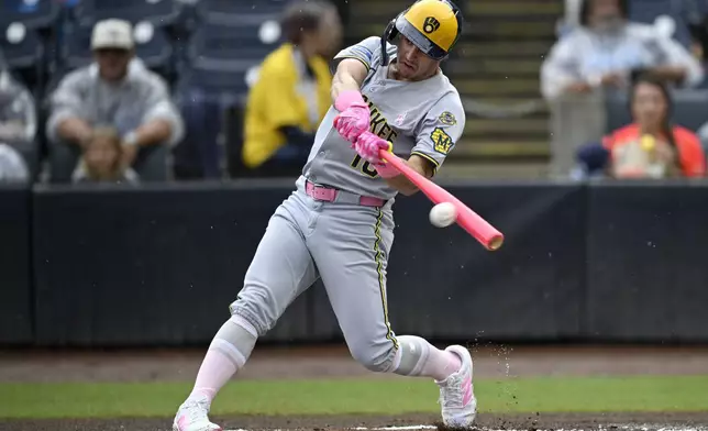 Milwaukee Brewers' Sal Frelick hits a ground ball for an out during the first inning of a baseball game against the Tampa Bay Rays, Sunday, May 11, 2025, in Tampa, Fla. (AP Photo/Phelan M. Ebenhack)