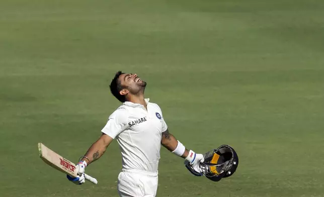 FILE - India's batsman Virat Kohli runs as he celebrates his century during the first day of their cricket test match against South Africa at Wanderers stadium in Johannesburg, South Africa, on Dec. 18, 2013. (AP Photo/Themba Hadebe, File)