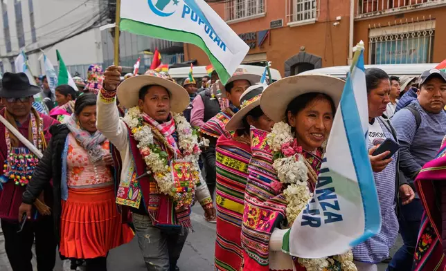 Supporters of presidential candidate Andronico Rodriguez march after a ceremony in which he announced his candidacy for the Alianza Popular (Popular Alliance) party, in La Paz, Bolivia, Monday, May 19, 2025. (AP Photo/Juan Karita)