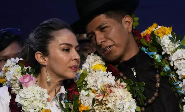 Senate President Andronico Rodriguez, right, chats with running mate Mariana Prado at a ceremony announcing their presidential candidacy for the Alianza Popular (Popular Alliance) party, in La Paz, Bolivia, Monday, May 19, 2025. (AP Photo/Juan Karita)