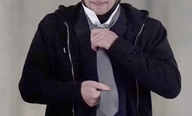 Adam Carruthers, 31, arrives to attend Newcastle Crown Court where he is accused of criminal damage after the felling of the Sycamore Gap tree - valued at £622,000 and £1,114 damage to Hadrian's Wall - in Newcastle, England, Wednesday, April 30, 2025. (PA via AP)