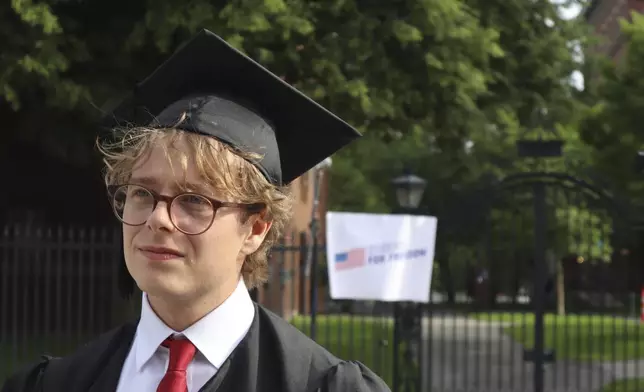 Harvard University graduating senior Leo Gerdén, an international student from Sweden, stands outside the Harvard University gates before a student protest against President Donald Trump's recent sanctions against Harvard, Tuesday May 27, 2025, in Cambridge, Mass. (AP Photo/Leah Willingham)